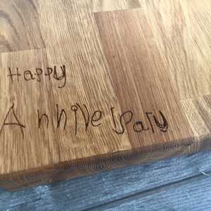 exact copy of handwriting engraved into oak